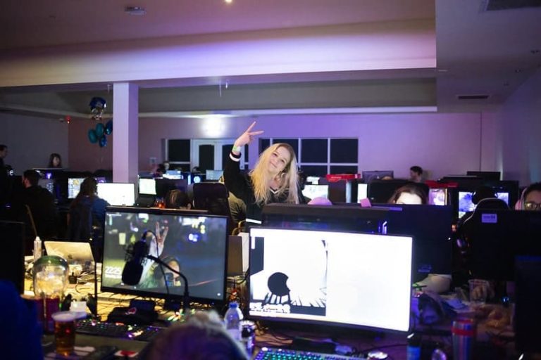EPIC LAN Gaming Hall With Girl Gesturing To Camera